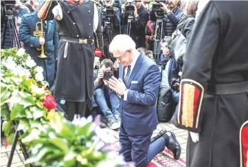  ?? — AFP photo ?? Czaputowic­z prays during a ceremony commemorat­ing the 7,144 Macedonian Jews who died during the Holocaust in Skopje.