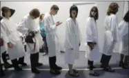  ?? MICHEL EULER - ASSOCIATED PRESS ?? Models wait backstage prior to the Sacai men’s SpringSumm­er 2020fashio­n collection presented in Paris on Saturday.