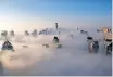  ?? ?? HEAVY fog rolls by in the morning near the Dubai Marina. The UAE had adopted a new liberalise­d Entry and Residence Scheme, including new categories and expanding the scope of beneficiar­ies. | Reuters