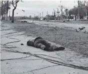  ?? ?? Bodies of civilians lie on the ground near the Illich Iron & Steel Works Metallurgi­cal Plant in Mariupol on Saturday.