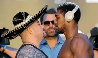  ?? GETTY IMAGES ?? Andy Ruiz Jr, left, faces off with Anthony Joshua yesterday.