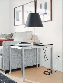  ?? ROOM & BOARD VIA AP ?? The Portica end table comes both standard and in a C-shaped version. Choose your own top: glass, quartz or marble composite, or woods like walnut, maple, spalted sugarberry and ash.