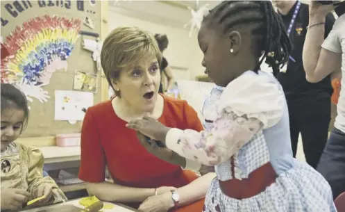  ?? PICTURE; PA ?? First Minister Nicola Sturgeon meets children at the Butterfly Nursery in Arden, Glasgow, yesterday