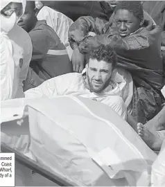  ??  ?? File photo shows a man now identified as Mohammed Ali Malek (centre) seated on board the Italian Coast Guard vessel Bruno Gregoretti, at Boiler Wharf, Senglea in Malta, as rescuers evacuate the body of a victim. — AFP photo