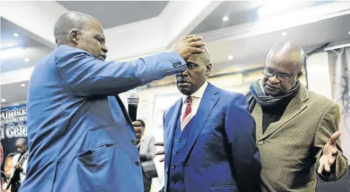  ?? /THULANI MBELE ?? Pastors pray for former SABC chief operating officer Hlaudi Motsoeneng at a church in Ackerville, Emalahleni, yesterday. Motsoeneng was recently fired by the public broadcaste­r after he held an unauthoris­ed press briefing.