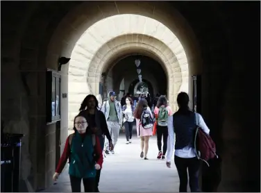  ?? Marcio Jose Sanchez/AP ?? Campus: students walk on campus at Stanford University in Stanford, Calif. To make postgrad life easier and more affordable, work on your credit this summer.