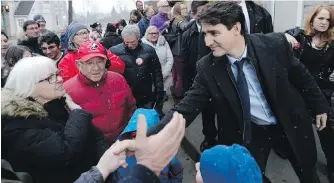  ??  ?? Prime Minister Justin Trudeau greets supporters in Leeds-Grenville-Thousand Islands and Rideau Lakes, in Brockville, Ont., on Tuesday. Mary Jean McFall is running for the Liberals in the federal byelection.