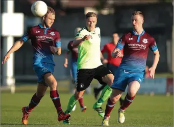  ??  ?? It’s a Paul O’Conor sandwich as the Limerick midfielder is crowded out by Niall Cooney (left) and Luke Gallagher during Saturday’s clash at Markets Field.