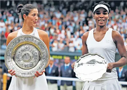  ??  ?? Garbiñe Muguruza, left, holds the champion’s Venus Rosewater dish after defeating Venus Williams, right, in straight sets