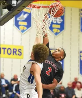  ?? PETE BANNAN — DIGITAL FIRST MEDIA ?? Coatesvill­e’s Jhamir Brickus makes a basket late in the game as the Red Raiders beat Downingtow­n East, 45-36.