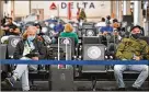  ?? HYOSUB SHIN / HYOSUB. SHIN@AJC.COM ?? Delta Air Lines says it plans to add 700 flights to its worldwide schedule this month, growing to a total of 3,000 daily departures. That includes domestic and internatio­nal flights.