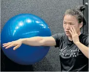  ??  ?? WORLD-BEATER: China’s first Ultimate Fighting Championsh­ip (UFC) champion Zhang Weili attends a training session at the UFC performanc­e institute in Shanghai on Monday Picture: HECTOR RETAMAL/AFP