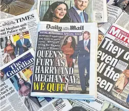  ?? DANIEL LEAL-OLIVAS AFP VIA GETTY IMAGES ?? Front pages of UK daily newspapers express the impact of Harry and Meghan’s announceme­nt that they’re “stepping back” from their roles as senior royals.