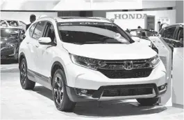  ?? FREDERIC J. BROWN/GETTY-AFP ?? The 2018 Honda CR-V, Motor Trend Magazine’s 2018 SUV of the Year, on display at the 2017 Los Angeles Auto Show.