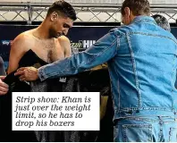  ??  ?? Strip show: Khan is just over the weight limit, so he has to drop his boxers