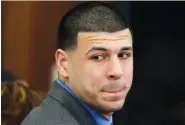  ?? AP PHOTO/STEPHAN SAVOIA ?? Former New England Patriots tight end Aaron Hernandez turns to look in the direction of the jury in Boston last year as he reacts to his double murder acquittal in the 2012 deaths of Daniel de Abreu and Safiro Furtado.
