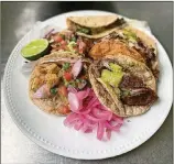  ?? WENDELL BROCK FOR THE ATLANTA JOURNALCON­STITUTION ?? Danimarco Tacos operates as a pop-up out of We Suki Suki in East Atlanta Village and Boggs Social & Supply in Westview.