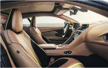  ??  ?? The interior is swathed in Dark Knight leather with lime-coloured detailing.
