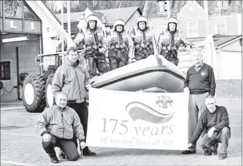  ?? 01_B11twe01 ?? Men of the Arran RNLI pose with their lifeboat to mark the 175th birthday of saving lives at sea.