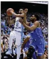  ?? AP/GERRY BROOME ?? North Carolina’s
Joel Berry II (left) scored 21 points in the No. 21 Tar Heels’ 82-78 victory over No. 9 Duke on Thursday night in Chapel Hill, N.C.