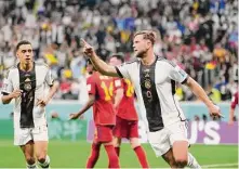  ?? Luca Bruno / Associated Press ?? Germany’s Niclas Fuellkrug (right) celebrates after his goal evened the score against Spain in the 83rd minute.