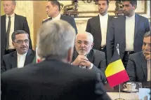  ?? VIRGINIA MAYO — THE ASSOCIATED PRESS ?? Iranian Foreign Minister Jawad Zarif, center right, speaks with Belgian Foreign Minister Didier Reynders during a meeting at the Egmont Palace in Brussels on Thursday.