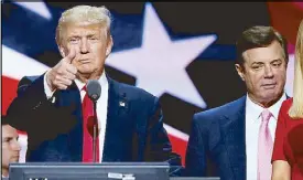  ?? REUTERS ?? Then-Republican presidenti­al nominee Donald Trump gives a thumbs-up as his campaign manager Paul Manafort looks on during Trump’s walk-through at the Republican National Convention in Cleveland on July 21, 2016.