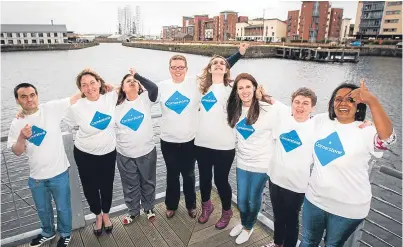  ?? Picture: Steve MacDougall. ?? Cornerston­e staff and those they help come together at their office on City Quay to get behind the bid to win The Courier’s minibus.