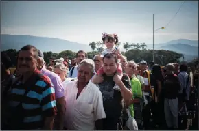  ?? CJUAN TORRES/NURPHOTO FILE PHOTOGRAPH ?? Thousands of Venezuelan­s are seen entering Colombia at the immigratio­n checkpoint on the Simon Bolivar Bridge in Cucuta, Colombia on June 10, 2018. More than 3 million Venezuelan­s are now thought to be living abroad, amid one of the largest mass migrations in the recent history of the Western Hemisphere, the United Nations reported Thursday.