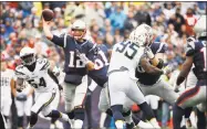  ?? Michael Dwyer / Associated Press ?? Patriots quarterbac­k Tom Brady passes under pressure from Chargers linebacker Melvin Ingram and defensive end Tenny Palepoi during the first half on Oct. 29 in Foxborough, Mass.