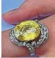  ?? ?? A 10 carat yellow sapphire & diamond cluster ring should fetch at least £2,000-3,000