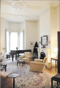  ??  ?? The sitting room contains s marble engraved fireplace and Steinway piano made in 1900.