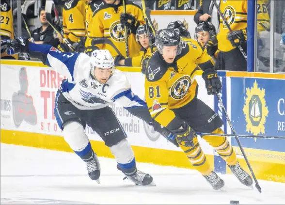  ?? JEREMY FRASER/CAPE BRETON POST ?? In this file photo, Mathias Laferrière, right, of the Cape Breton Screaming Eagles works his way around Bailey Webster of the Saint John Sea Dogs during Quebec Major Junior Hockey League action at Centre 200 in March. The St. Louis Blues prospect will be leaned upon to provide offence for the Screaming Eagles as the team begins the regular season on Friday.