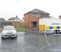  ??  ?? Police and a forensic team in the area described as “quiet” and “normally peaceful” by residents.