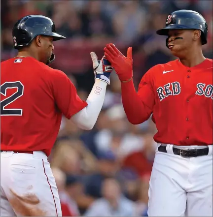  ?? MATT STONE / BOSTON HERALD FILE ?? Xander Bogaerts, left, and Rafael Devers have seen their All-star candidacie­s diminish in the most recent voting update from MLB.