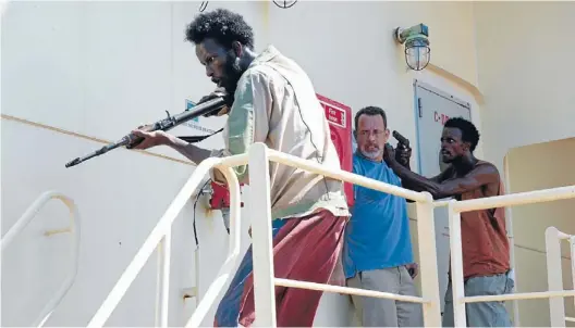  ??  ?? Under the gun: TomHanks as Captain Phillips in a scene from the film.