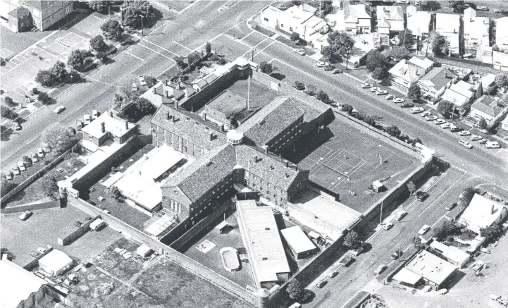  ??  ?? FROM ABOVE: The Old Geelong Gaol as it looked from the air in 1987 when it was still in use as a prison. The former Swanston St primary school can be seen in the top left of the photo.