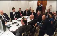  ?? AP HANDOUT COURTESY THE WHITE HOUSE ?? In this image provided by the White House, President Donald Trump receives a briefing on the Syria military strike from his National Security team, including a video teleconfer­ence with Secretary of Defense, Gen. James Mattis, and Chairman of the Joint...