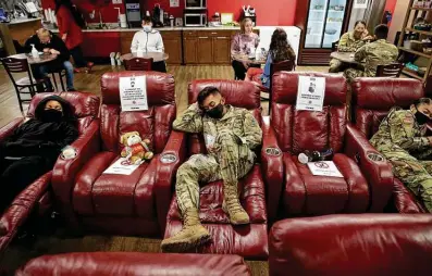  ?? Photos by Jerry Lara / Staff photograph­er ?? Army Pvt. Zachry Sanmartino, 19, of Fort Eustis, Va., rests at the San Antonio Internatio­nal Airport USO. Troops from Joint Base San Antonio started the annual holiday break departures Saturday.