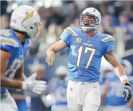  ?? GETTY IMAGES ?? With a pair of wins in five days, quarterbac­k Philip Rivers and his Los Angeles Chargers have nearly climbed all the way out of the 0-4 hole they dug to start the 2017 season.