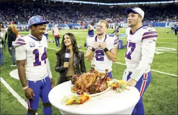  ?? AP photo ?? Bills wide receiver Stefon Diggs (from left), place kicker Tyler Bass and quarterbac­k Josh Allen are interviewe­d in front of a huge turkey after Buffalo defeated the Detroit Lions 28-25 on Thursday.