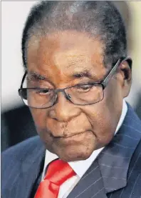  ?? AP PHOTO/THEMBA HADEBE ?? Zimbabwean President Robert Mugabe, seen earlier this month in South Africa, has run the country for 37 years during which the economy has collapsed, Unemployme­nt has soared to 75 per cent or higher, and schools and hospitals have fallen apart.