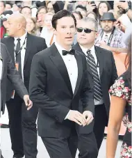  ??  ?? Actor Benedict Cumberbatc­h (centre) attends the opening night of ‘The Fifth Estate’ gala at Roy Thomson Hall at a past Toronto Internatio­nal Film Festival.