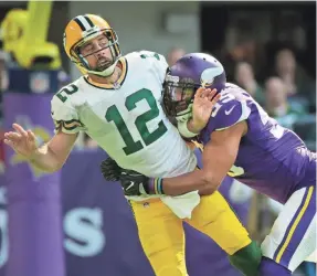  ?? MARK HOFFMAN / MILWAUKEE JOURNAL SENTINEL ?? Of Anthony Barr’s hit on Aaron Rodgers, the Packers’ Ahmad Brooks says, “he didn’t have to drive him into the ground.”