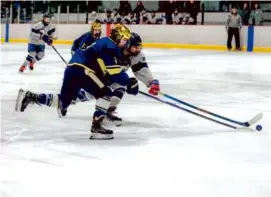  ?? MATTHEW J. LEE/GLOBE STAFF ?? Archbishop Williams’s Julie Murphy (left) faced pressure from St. Mary’s freshman Bella Freitas in the first period.