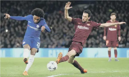  ??  ?? Willian slams home Chelsea’s opener against Barcelona at Stamford Bridge last night.