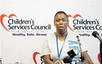  ?? MARK RANDALL/STAFF PHOTOGRAPH­ER ?? Katina Gadson tearfully recounts the deaths of her 2-year-old twin cousins, who drowned in a pool last year, as she addressed the Children’s Services Council of Palm Beach County in Boynton Beach on Thursday.