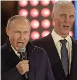  ?? ?? Facing the music... Putin, left, and Saldo at a concert in Moscow