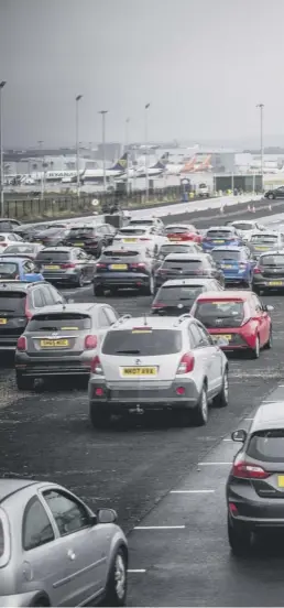  ??  ?? Movie- goers watch Sunshine On Leith in their cars at the socially distanced Drive- in Movie arena which has been set up at Edinburgh Airport as part of the Edinburgh Internatio­nal Film Festival