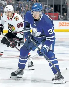  ?? CLAUS ANDERSEN/GETTY IMAGES ?? Chicago Blackhawks’ winger Patrick Kane skates against Auston Matthews, of the Toronto Maple Leafs, during a game at the Air Canada Centre on Monday, in Toronto. The Leafs won the game 4-3, with Matthews scoring the overtime winner.